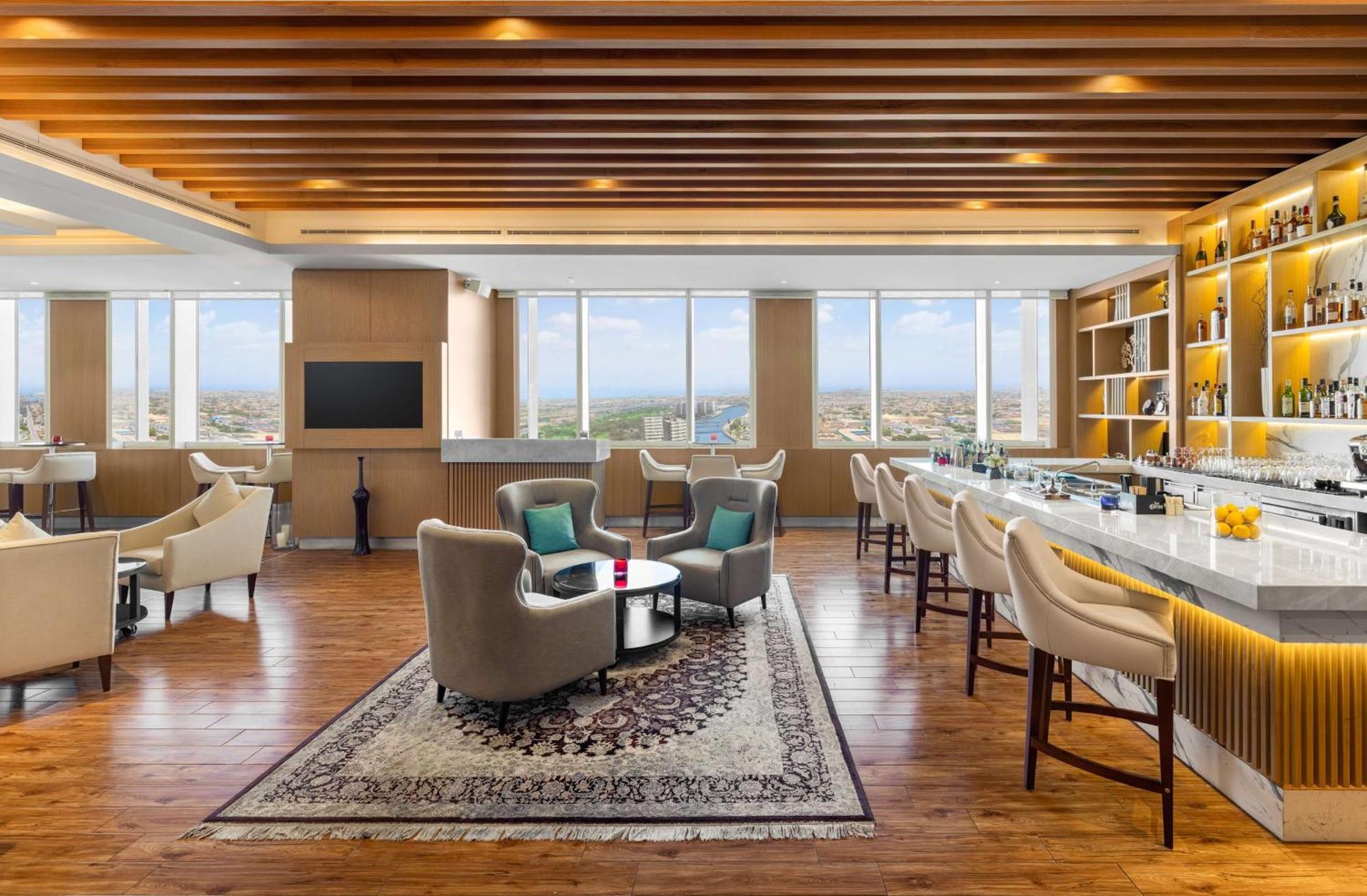 V Hotel Dubai, Curio Collection By Hilton Экстерьер фото The Club Lounge at the hotel