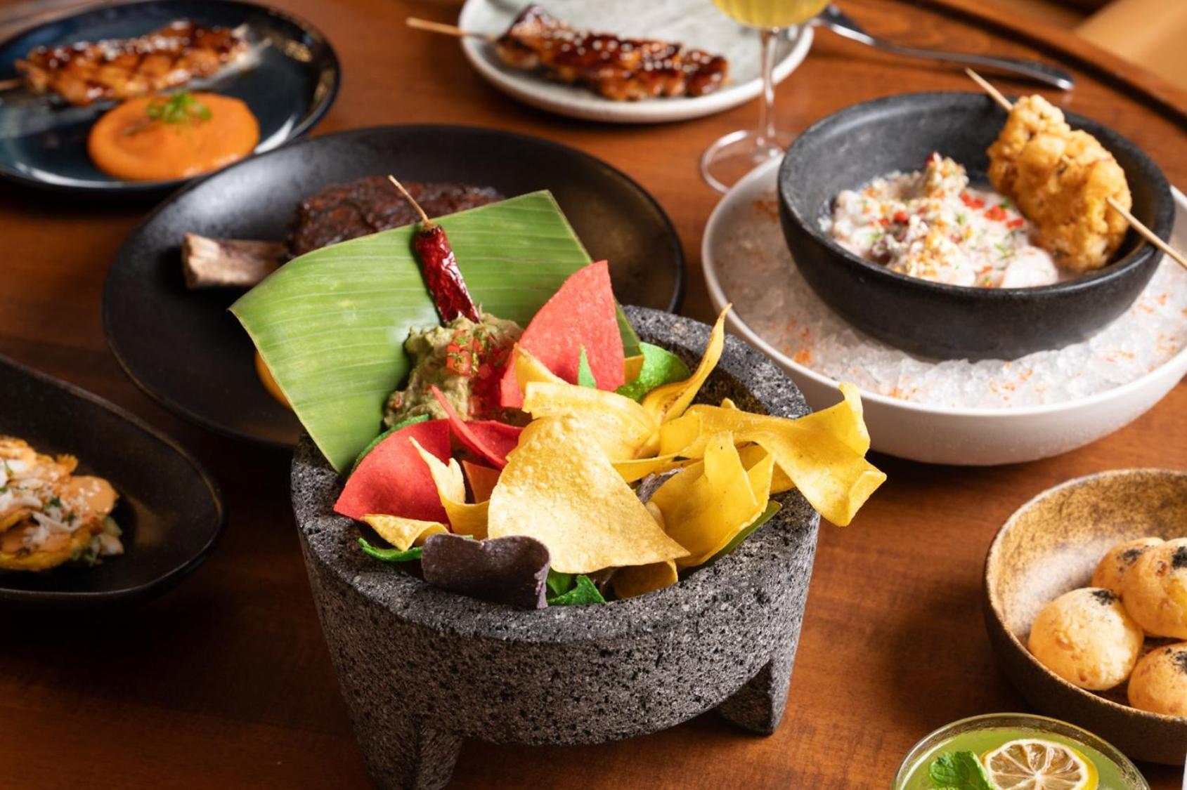 V Hotel Dubai, Curio Collection By Hilton Экстерьер фото A selection of dishes at the restaurant